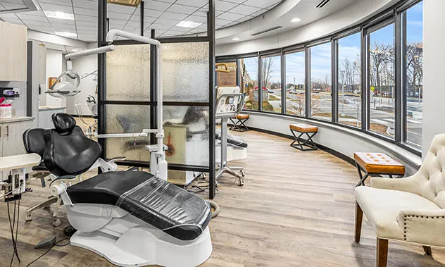 A wide-angle view of the clinical space showing comfortable waiting chairs and specialized orthodontic equipment.